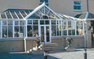 White t-shape conservatory with gable front