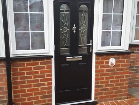 Black composite modern door designs installed in Croydon property