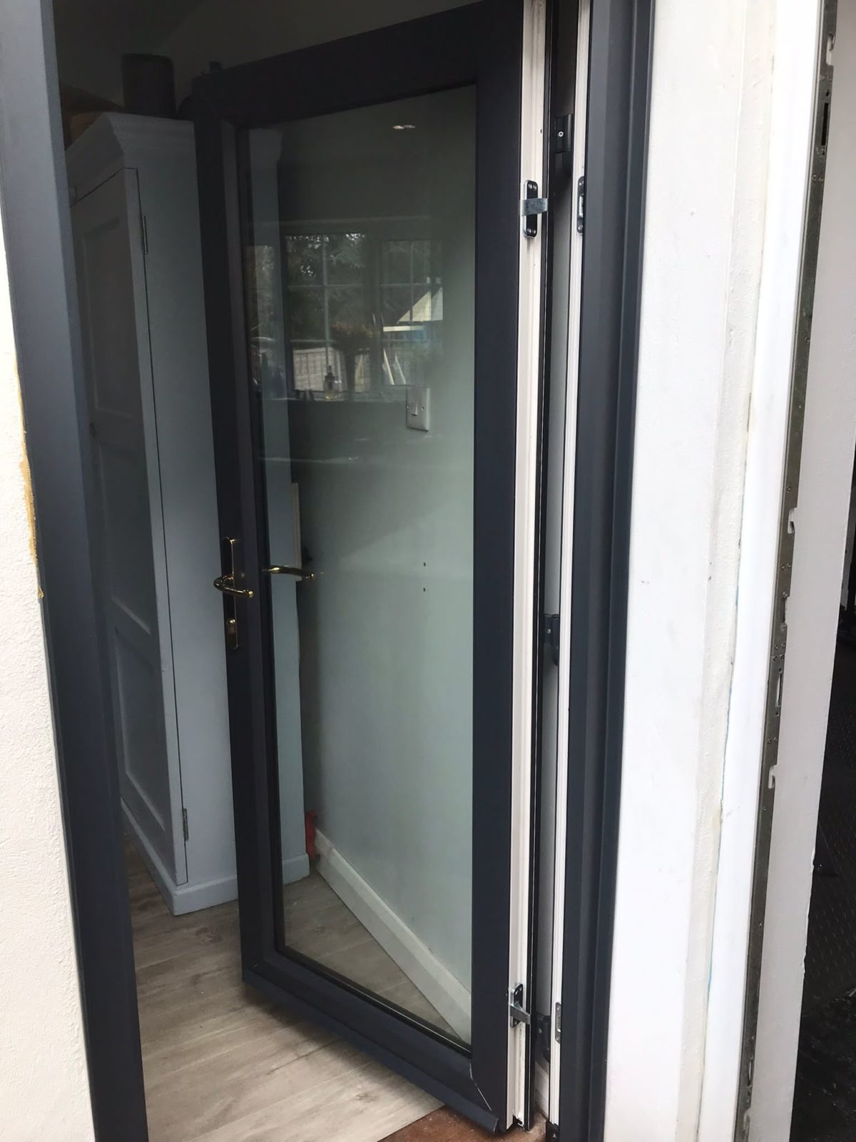 Composite Door With Modena Glass And A Grey UPVC Door