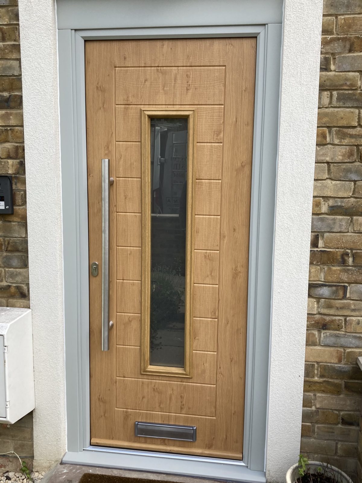 Composite Door Alto Design Complimented By A Light Grey Frame