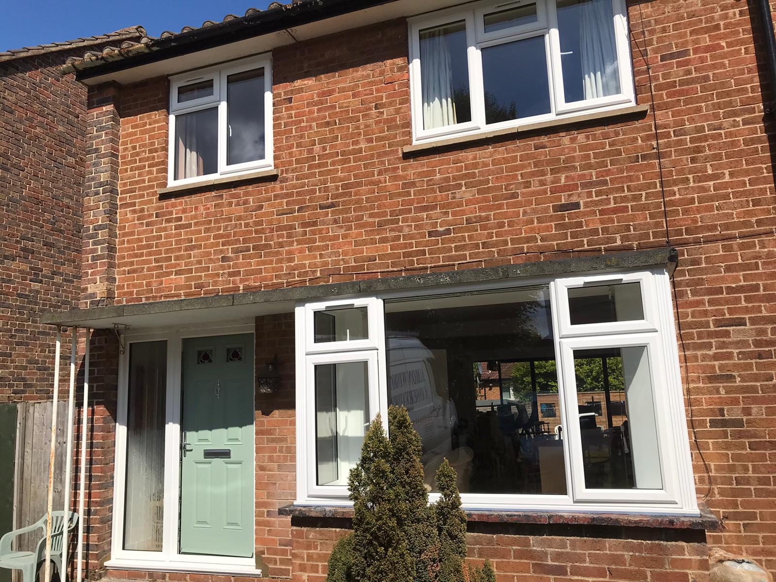 White Upvc Windows And Composite Front Door And Sidelight
