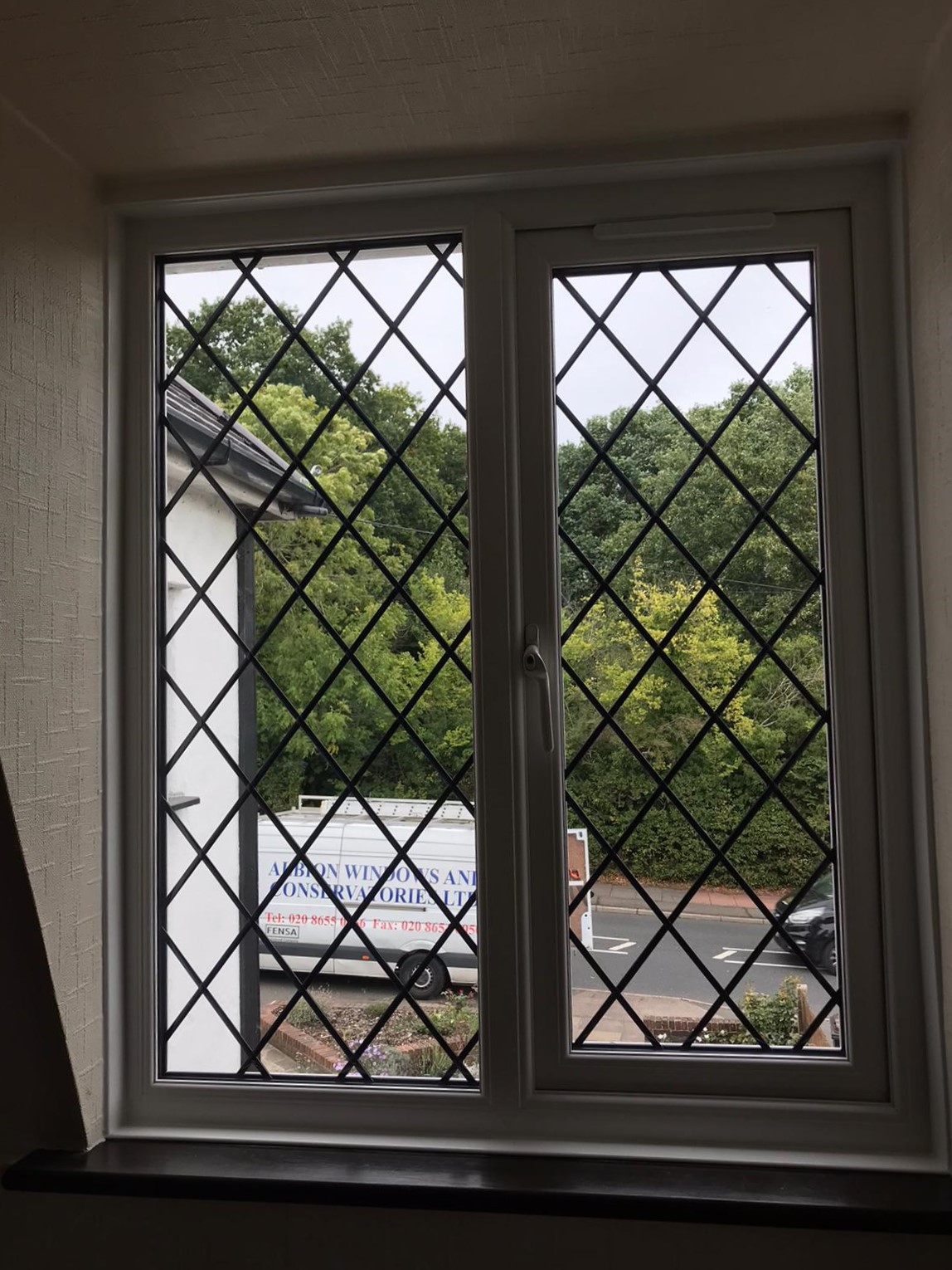 White Upvc Bay And Window With Black Cills And Trim In Bromley